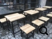 Zwarte steigerbuizen en steigerhout voor buitenterras, Bar Patron. Grote markt Antwerpen. Stilwood